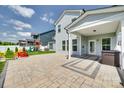 View of a backyard patio with seating, a well-maintained lawn, and privacy fencing at 4023 Spring Garden St, Fort Mill, SC 29715