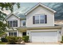 Charming two-story home with white siding, black shutters, and a two-car garage at 6332 Sackett Way, Charlotte, NC 28269