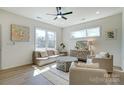 Spacious living room with large windows, comfortable seating, and a contemporary design at 709 Catawba St, Lincolnton, NC 28092