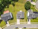 An aerial shot displays this home's landscaping and features, including a driveway and nearby street at 7212 Ravanna Dr, Charlotte, NC 28213