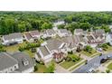 A neighborhood with beautiful homes and mature trees nestled near a serene lake at 14228 Twin Eagles Ln, Charlotte, NC 28278