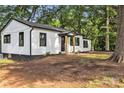 Charming home with a well-manicured lawn and a freshly painted exterior and black trim at 1739 16Th Ne St, Hickory, NC 28601