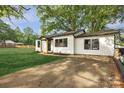 Charming home with a well-manicured lawn and a freshly painted exterior and black trim at 1739 16Th Ne St, Hickory, NC 28601