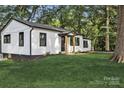 Charming home with a well-manicured lawn and a freshly painted exterior and black trim at 1739 16Th Ne St, Hickory, NC 28601
