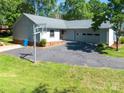 Well-maintained single-story home with a spacious driveway and attached two-car garage at 2011 20Th Street Ne Pl, Hickory, NC 28601