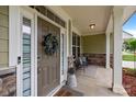 Close-up of the front door with sidelights, decorative wreath, and secure digital keypad entry at 20307 Creek Bend Edge Ct # 10, Matthews, NC 28105