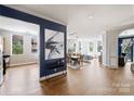 Spacious living room with hardwood floors, neutral paint, abundant natural light, and an open layout for seamless entertaining at 229 N Church St # 204, Charlotte, NC 28202