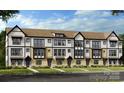 Modern townhome exteriors feature multi-tone brick and white siding, large windows, and individual entryways at 3110 Stelfox St, Charlotte, NC 28262