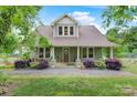 Charming home with lush landscaping, covered porch, and inviting curb appeal at 4335 E Nc 10 Hwy, Claremont, NC 28610
