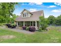 Beautiful two-story home with a well-manicured lawn, mature trees, and fenced yard at 4335 E Nc 10 Hwy, Claremont, NC 28610