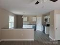 Bright kitchen featuring white cabinetry, granite countertops, and stainless steel appliances at 528 S Caldwell St, Salisbury, NC 28144
