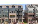 Charming three-story townhome showcasing a brick and siding exterior with well-maintained landscaping at 743 Anderson St, Charlotte, NC 28205