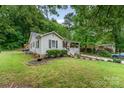 Charming single Gathering home with a cozy front porch and lush green yard at 107 Oakland Rd, Belmont, NC 28012