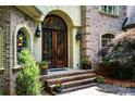 Elegant home featuring a detailed front door and brick facade at 122 Sleepy Cove Trl, Mooresville, NC 28117