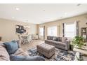 Spacious living room boasts hardwood floors, plenty of natural light, and stylish furnishings at 13221 Gadwal Pintail Dr, Charlotte, NC 28262