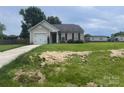 Charming single-story home with attached garage and well-maintained lawn with some hay spread out on the front yard at 1381 Steven Dr, Salisbury, NC 28147