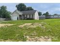 A single-story home with attached garage and well-maintained lawn with some hay spread out on the front yard at 1381 Steven Dr, Salisbury, NC 28147