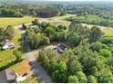 Aerial view of a home surrounded by lush greenery and mature trees at 1811 Continental Dr, Albemarle, NC 28001
