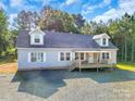 Beautiful home with a covered porch and lots of trees at 1811 Continental Dr, Albemarle, NC 28001