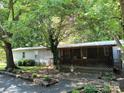 Charming single story home with a welcoming porch and well-maintained landscaping at 189 6Th Ave, New London, NC 28127