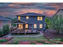 Enjoy this home's private backyard with a spacious deck, lush landscaping, and serene atmosphere at 1919 Madeira Cir, Waxhaw, NC 28173