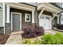 Inviting entryway featuring stone accents, stylish door, and well-maintained landscaping at 2018 Crooked Oak Ln, York, SC 29745