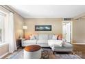 Comfortable living room with stylish rug, neutral walls, and cozy couch at 2638 Park Rd # H, Charlotte, NC 28209