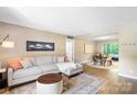 Inviting living room featuring a comfortable couch, a stylish rug, and an open layout at 2638 Park Rd # H, Charlotte, NC 28209