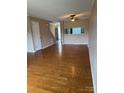 Open-concept living room featuring hardwood floors, ample natural light, and neutral paint at 303 Eastwood Dr, Salisbury, NC 28146