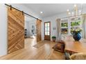 Welcoming entryway featuring beautiful hardwood floors, wooden sliding doors, and lots of natural light at 304 Keswick Ave, Charlotte, NC 28206