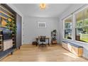 Bright home office with hardwood floors, a large window, and minimalist decor, offering a serene workspace at 304 Keswick Ave, Charlotte, NC 28206