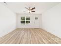 Inviting living room featuring wood floors, large window and glass panel door at 312 Adams St, Salisbury, NC 28144
