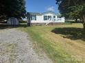 This lovely home has a well-manicured lawn and storage shed at 338 Hickory Grove Rd, Harmony, NC 28634