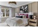 Serene bedroom with large window, contemporary lighting, and neutral color palette at 4110 Lattistep Ln, Charlotte, NC 28269