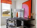 Bright office space with zebra chair, large window view, and colorful contemporary art at 4110 Lattistep Ln, Charlotte, NC 28269