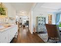 Entryway view showcases hardwood floors flowing into the living room with fireplace at 4151 Green Park Ct, Harrisburg, NC 28075