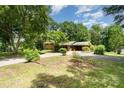 Spacious home with ample green space, featuring a long driveway and mature trees for added privacy at 52 September Ct, Concord, NC 28025