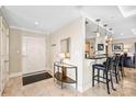 Entryway with adjacent bar area featuring marble floors and neutral walls at 520 E Martin Luther King Jr Blvd # 1002, Charlotte, NC 28202