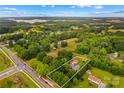 An aerial view shows the property lines surrounding the home on a large lot in a quiet neighborhood at 648 Odell School Rd, Concord, NC 28027