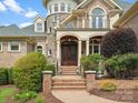 Close up of front entrance with stone accents, arched doors, and brick entryway at 6742 Charlotte Hwy, York, SC 29745