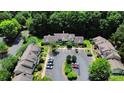 Community aerial view featuring multiple townhome buildings, parking lots, and green spaces at 9216 Four Mile Creek Rd, Charlotte, NC 28277