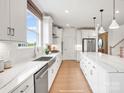 Well-lit kitchen featuring marble countertops, stainless steel appliances, and a stylish center island at 1022 Paddlers Way # 136, Belmont, NC 28012