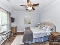 Comfortable bedroom with ceiling fan, stylish decor, and a serene ambiance at 10800 Alabaster Dr, Davidson, NC 28036