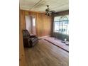 Spacious living room featuring wood-paneled walls and a ceiling fan at 1313 Lower Dallas Hwy Hwy, Dallas, NC 28034