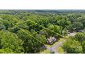 Aerial view of wooded property showcasing boundaries at 203 E College St, Star, NC 27356