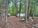 View of lot surrounded by trees with white van and shed at 2206 Meadow Rd, Clover, SC 29710
