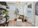 Beautiful flex room with hardwood floors, natural light, black shelving and decor at 2658 Headwind Ct # 245, Belmont, NC 28012