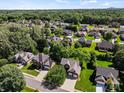 Aerial view of a leafy residential area showcasing neatly arranged homes with green lawns at 3124 17Th Street Ne Ln, Hickory, NC 28601