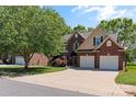 Charming home with brick facade, two-car garage, and a lush green lawn at 3124 17Th Street Ne Ln, Hickory, NC 28601