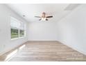 Bright and spacious bedroom featuring wood flooring, a ceiling fan, and a large window at 314 Adams St, Salisbury, NC 28144